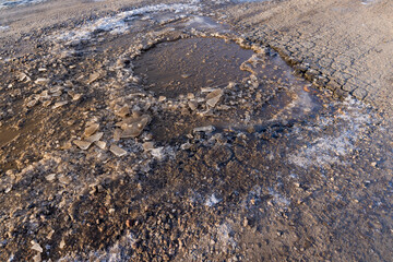 broken ice on the highway in winter season