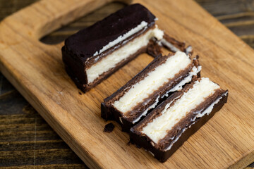 chocolate-covered sweet cookies with creamy cottage cheese