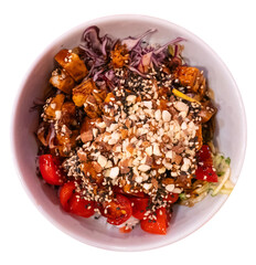 Poke bowl made with chicken meat, vegetables and chopped nuts