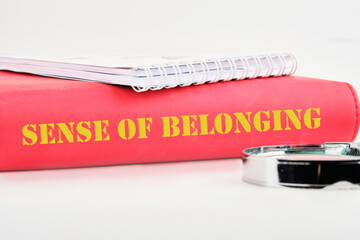 Business, sense of belonging concept. Text Sense of belonging on the back of the book cover, a...