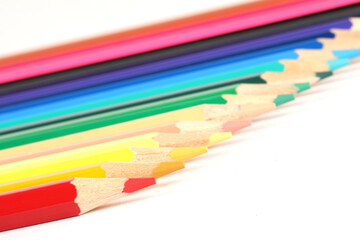 Naklejka premium A close-up of colorful crayons isolated on a white background 