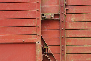 A close-up of an old train wagon which is out of order
