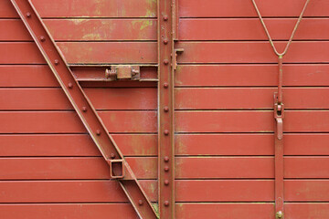 A close-up of an old train wagon which is out of order
