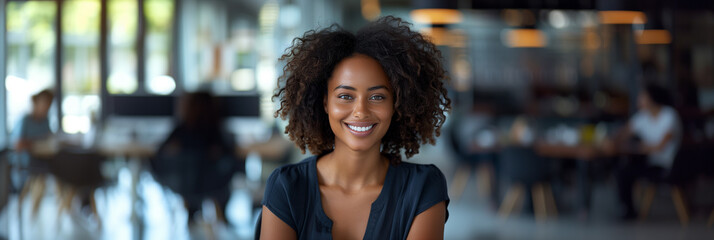Young african american business woman smiling closeup portrait blur office background