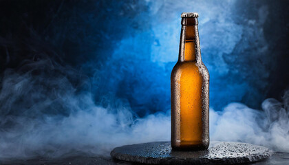 Glass bottle of beer with water drops. Blue white smoke of backdrop. Alcoholic beverage.