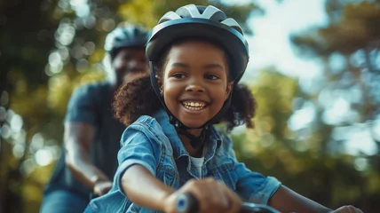 Foto op Plexiglas Afroamerican child girl riding a bicycle © gpointstudio