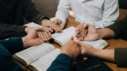 Christian group holding hands pray and worship god together on the sunday morning.spirituality,...