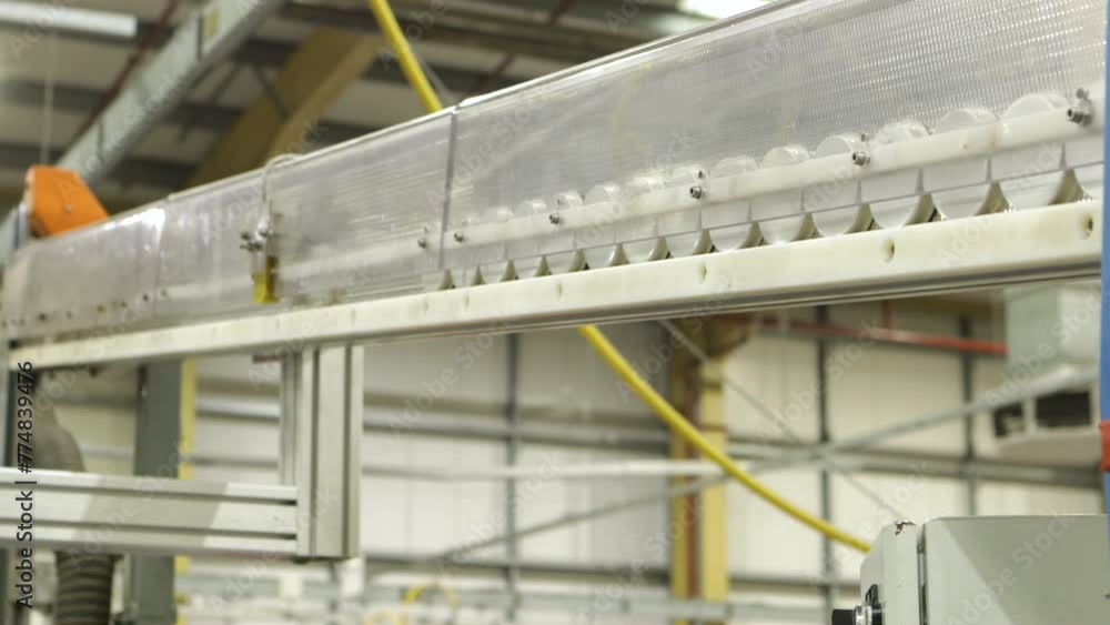 Poster cap lining machine manufacturing in a automatic machine caps are moving through the conveyor line