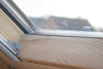 Close up of condensation on velux window in a house, water drops and hight humidity