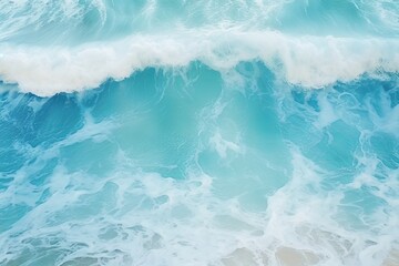 Blue ocean waves with foam, summer background, top view.