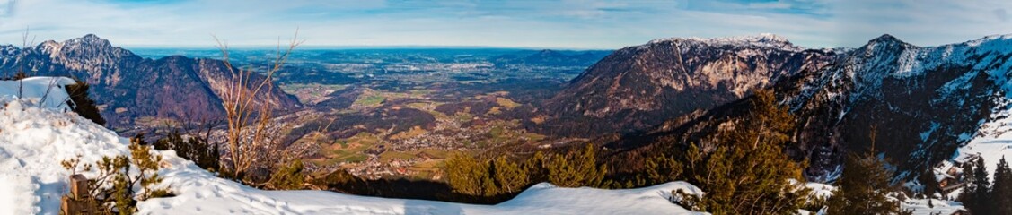 High resolution stitched alpine winter panorama with Mount Hochstaufen and the city of Salzburg in...