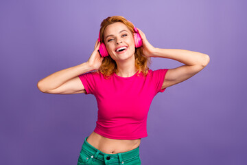 Plakaty  Photo of cheerful adorable nice woman wear stylish pink clothes enjoy listening music isolated on purple color background