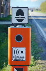 Traffic Enforcement Camera with TEXT that means electronic speed control in italian language and symbol of police