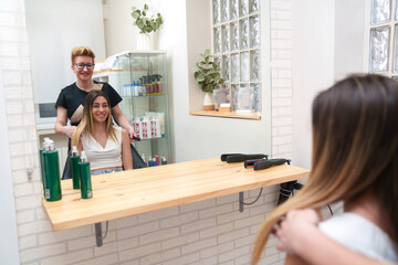 Stylist prepares a client for a hair treatment.