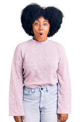 Young african american girl wearing casual clothes afraid and shocked with surprise expression, fear and excited face.