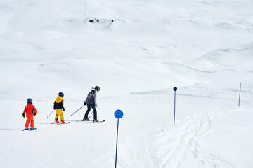Picture of mother teach skiing her kids in Madonna di Campiglio - 774860278