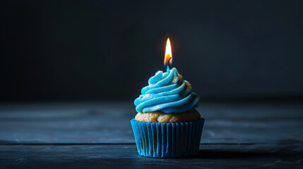 Aesthetic blue cupcake with candle, dark background, copy space. Celebration anniversary concept. Generative AI - obrazy, fototapety, plakaty
