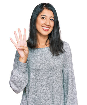 Beautiful asian young woman wearing casual clothes showing and pointing up with fingers number four while smiling confident and happy.
