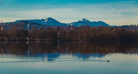 Alpine winter view with reflections at Lake Waginger See, Traunstein, Bavaria, Germany