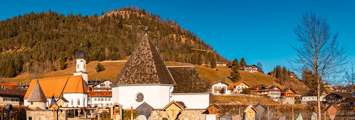 High resolution stitched alpine winter panorama with a church at Wallgau, Garmisch-Partenkirchen,...