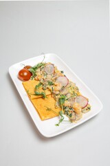 Plated Crepes with Creamy Seafood and Pea Pods. Carnival menu.