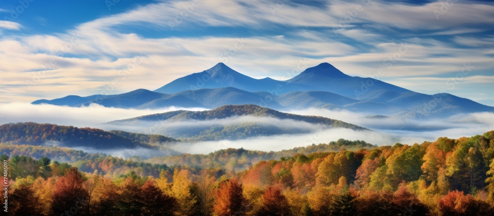 Poster capturing a peaceful landscape, a beautiful mountain range stands tall with a few trees in the foreg