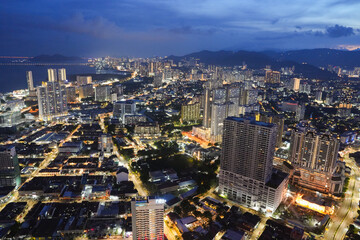 A view of the cityscape of Penang in Malaysia during the blue hour of the day.