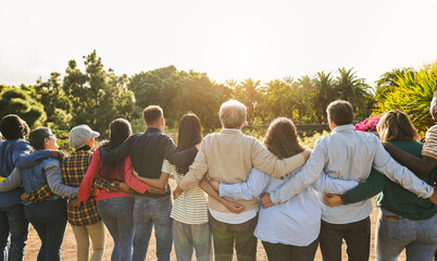 Group of multigenerational people hugging each others - Support, multiracial and diversity concept...