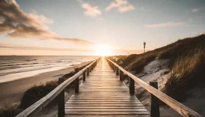 Gordijnen empty wooden walkway on the ocean coast in the sunset time pathway to beach © Claudio