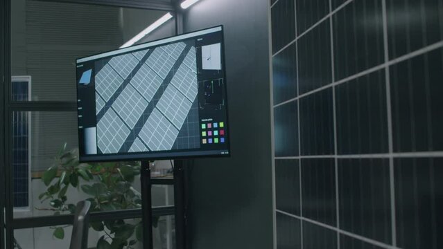 No people footage of multimedia screen with solar panel system layout moving image in modern office at green energy department