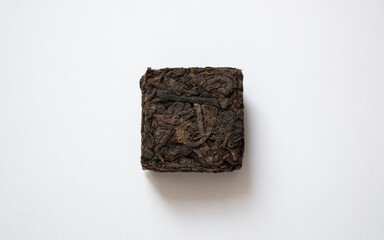 Pressed shu puerh on a white background