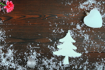 New Year's card on a wooden background.Christmas balls are toys.the glove of Santa Claus.santa...