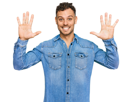 Young hispanic man wearing casual denim jacket showing and pointing up with fingers number ten while smiling confident and happy.