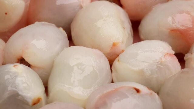 Lychee fruits peeled by rotation in circle. tropical fruit lychee, Turning. selective focus.