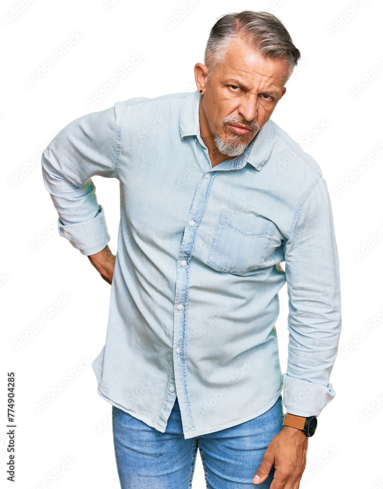 Canvas Prints Middle age grey-haired man wearing casual clothes suffering of backache, touching back with hand, muscular pain