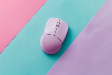 a pink computer mouse on a blue and pink background
