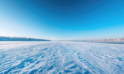 Fototapeta na wymiar A panoramic view of the frozen lake and bright blue sky, winter nature background