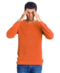 Young african amercian man wearing casual clothes suffering from headache desperate and stressed because pain and migraine. hands on head.