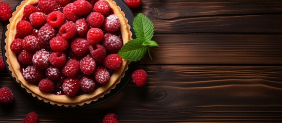 A delicious pie covered with fresh raspberries showcased on a rustic wooden table