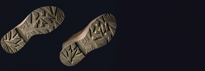 Bottom of shoes, isolated on black background.
