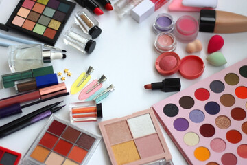 Various colorful beauty products on white background. Selective focus.