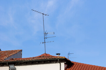 These antennas are commonly seen on residential buildings, providing access to TV signals. They dot...
