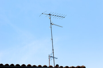These antennas are commonly seen on residential buildings, providing access to TV signals. They dot...