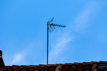 These antennas are commonly seen on residential buildings, providing access to TV signals. They dot...
