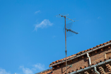 These antennas are commonly seen on residential buildings, providing access to TV signals. They dot...