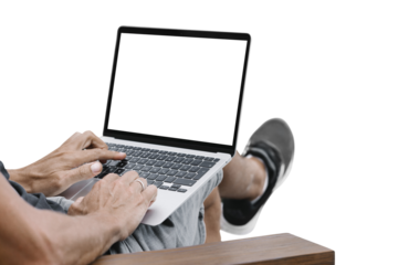 a man works in nature, sitting in a chair with a laptop