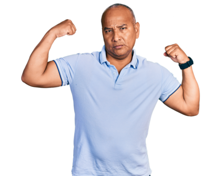 Hispanic middle age man wearing casual t shirt showing arms muscles smiling proud. fitness concept.