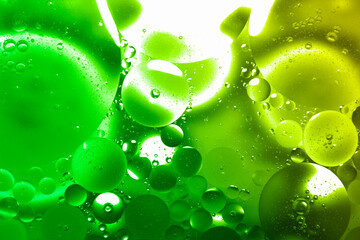Green oil on the surface of the water separates.
