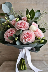 
Pink carnations and eucalyptus bouquet