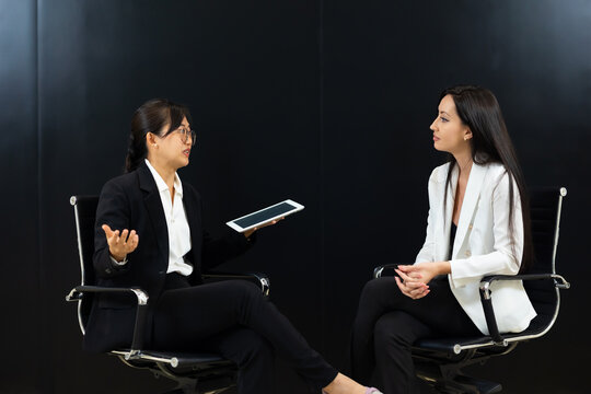 Business interview on stage. TV Show. ceremony is interviewing participants in a business conversation